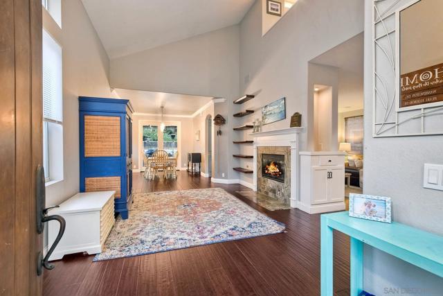 Soaring ceilings and engineered bamboo flooring greet you as you enter this beautiful home.