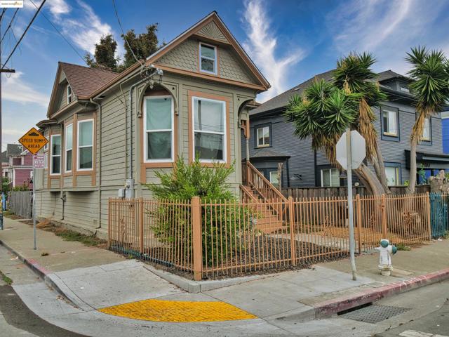 Victorian house with a fenced front yard