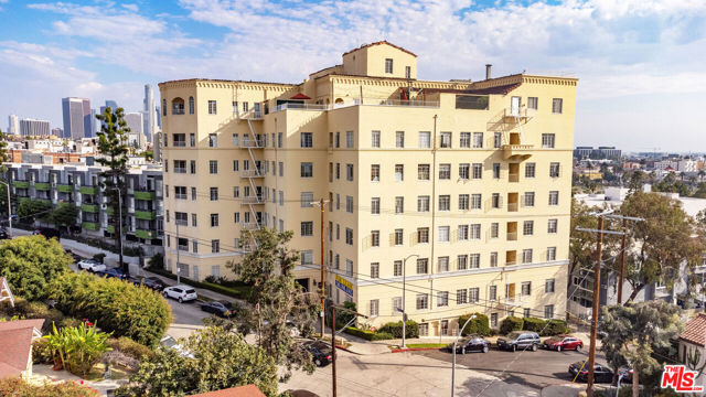 2430 Ocean View Avenue Los Angeles, California We are pleased to present Nob Hill Towers at 2430 Ocean View Ave Los Angeles, 90057a 7-story, 52-unit, architecturally significant (with Mills Act Potential), classic 1920s building located in the Westlake submarket of Los Angeles just 1 block from MacArthur Park and just over 1 mile to the heart of Downtown Los Angeles. Built in 1929, this unique concrete building is comprised of 2 Small (0+1), 28 (0+1), 13 (1+1), 4 (1+1+den), and 5 (2+2) units that range from approximately 300-2,500 gross square feet. The 52,871 square foot structure is situated on a 13,024 square foot, LAR4-1 zoned lot. The property offers an art deco feel with vintage charm and classic period finishes throughout the lobby, common areas, and units. The building's units feature incredibly spacious layouts with hardwood floors, Neoclassical fireplaces, floor radiator heaters; and most units have sweeping city/mountain views. There are two elevators in the building, onsite laundry (4 washing/6 drying machines), secured garage parking for 20 cars, 8 large storage rooms in a vast basement (3 of which are leased to tenants for additional income), and the building is master metered for electricity, gas, and water. There is a RUBS program in place in which tenants reimburse the landlord monthly for a portion of the utility costs. All tenants have access to the building's unique rooftop patio with views of the city, Santa Monica Mountains, and the Downtown Los Angeles skyline. The property boasts an excellent WalkScore rating of 94 and is one block away from Westlake's MacArthur Park billed as Los Angeles' version of New York's Central Park when it was under construction. Today it has become much more than the green grass and lake that comprise it. The park and the 2.72-mile area surrounding it also called Westlake is one of LA's most historic neighborhoods. Victorian homes and apartment complexes characterize the area, but newer developments are going up quickly. You'll find an eclectic mix of bars and restaurants on the east side of the park. Big-box stores will take care of most of your retail needs, while entertainment lovers will appreciate the Crypto Arena and LA Convention Center residing just across the 110 Freeway. The park is the biggest calling card of the neighborhood, and it has become increasingly well-maintained over the last few years. The building is just six blocks (0.6 miles) away from the Metro Red/Purple Line Westlake/MacArthur Park Station and 0.8 miles away from the Metro Red/Purple Line Wilshire/Vermont stationproviding easy access to Downtown, Hollywood, the Westside and surrounding areas. Downtown LA and the 101/110 freeways are all within 1.5 miles of the property, offering residents effortless access to countless shopping, dining, entertainment, and recreation options of revitalized Downtown Los Angeles, Koreatown, Hollywood, Echo Park, and Silver Lake. The property also presents a tangible value-add opportunity to legalize and lease two existing, non-conforming units. Unit 606 is fully remodeled and currently being used as an office; however, it has the potential to be transformed into a desirable rental unit, generating approximately an additional $1,950 in monthly rent, or $23,400 per year. Unit 110 is currently being used for building storage and will require renovation prior to being rent-ready. Nob Hill Towers is well positioned for a skilled value-add investor to implement a high-end unit/common area renovation program optimizing market rents, appreciation, and future returns.