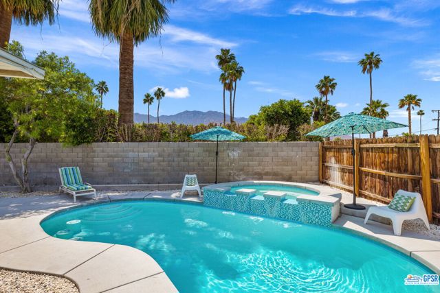 765 S Calle Paul Palm Springs, California Fantastic POST + BEAM Palm Springs getaway with an IMPRESSIVE vacation rental history. Sun-filled pool + spa, San Jacinto Mountain views, and modernist design. An especially light + bright kitchen is a joy with its counter seating, stylish finishes, and a lovely glass door opening to the side yard. Just past living and dining, a covered patio overlooks a kidney-shaped pool w/ elevated spa. Waterfalls + underwater stools in the mix! The vibe is "Palm Springs Weekend" circa 1960-something. Mature, waterwise landscaping (turf too) surrounds. Walled + gated privacy is another plus. En suite primary bath is updated and keeps with the MCM (albeit updated) finishes. Guest bedrooms #2 and #3 share a bath w/ tile shower. There's direct access to the patio which works well for backyard guests with wet feet. And did we mention an impressive rental history? Elsewhere, one wall of the carport features secure walk-in storage. The long driveway accommodates guest parking. Location for this corner home on a quiet street is another plus as Calle Paul is just a few blocks from Palm Springs' largest park (Demuth). Walking and biking are a breeze in this pocket sandwiched between South Palm Springs and Downtown. Fee Land (you own it). Enjoy it all!