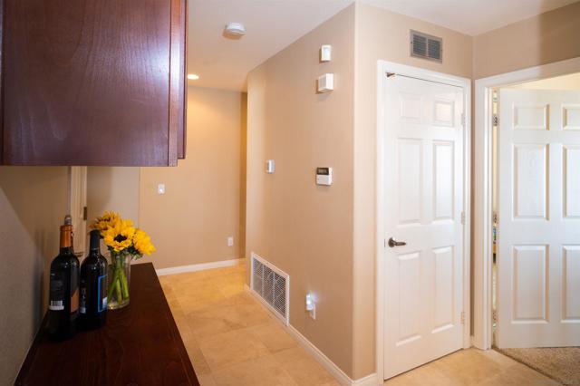 The door on the left is an AV closet with a fan installed. The door to the right is bedroom #2.At the end of the hall are bedrooms #3 & #4.