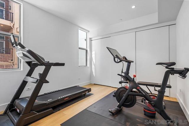 Home gym features luxury hardwood flooring, huge closets and plenty of room for a treadmill, Peloton and more.