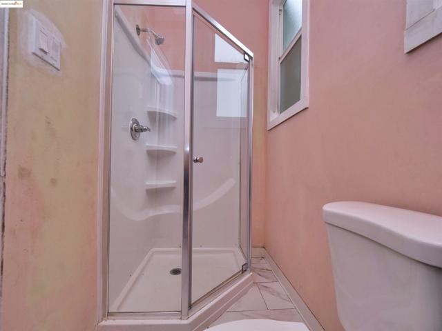Full bath with a stall shower and tile patterned floors