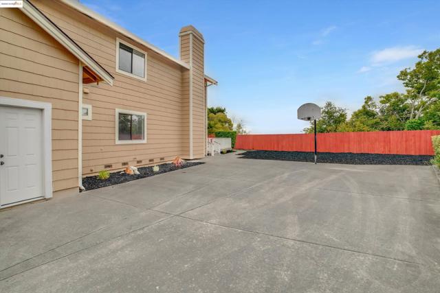 View of home's exterior with a chimney, a patio area, and crawl space