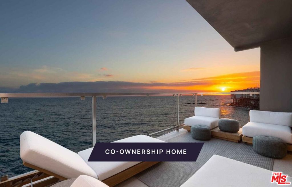 New co-ownership opportunity: Own one-eighth of this professionally managed, turnkey home. Named for the beach just steps away, Las Flores is a perfect oceanfront hideaway, with stunning views of the sparkling Pacific, islands and Queen's Necklace. This two-story contemporary has decks on both levels and private steps leading to the shore.  Inside, the open concept layout is all about endless vistas, relaxation and entertaining. The first floor has floor-to-ceiling, wall-to-wall glass sliders plus a picture window, framing views to enjoy the living and dining area as well as the gourmet kitchen. The doors open to a covered balcony perfect for al fresco dining. The kitchen features Caesarstone countertops, high-end stainless steel appliances, a beverage fridge and bar seating. Behind the kitchen is a handy laundry area and a full bathroom is nearby.  One of two staircases leads directly to the primary suite, which features a fireplace, a beachfront balcony and a spa-style en suite bathroom with a soaking tub, tiled shower and dual-sink vanity. The other stairway goes to a landing with doors to a private patio. Also on this level are a guest bedroom and bathroom,  and a family room/office which is also accessible from the primary suite.  This getaway is midway between Malibu and Santa Monica, and close to Duke's Malibu, Nobu and shopping. The home, which has a two-car garage with a second refrigerator, comes fully furnished and professionally decorate