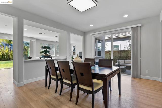 Dining area with recessed lighting and light wood-style floors