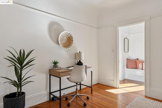 Office space featuring light wood-style flooring and baseboards