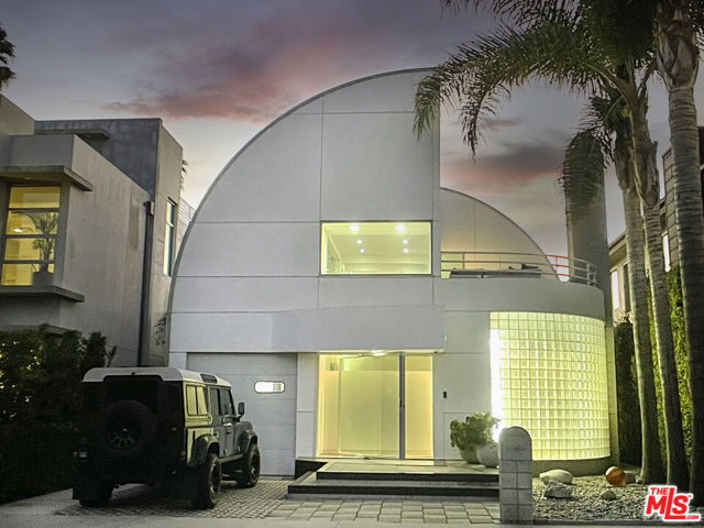 2409 Wilson Avenue Venice, California Captivating architectural is sure to wow! With its large airy open spaces, brilliant design and distinctive iconic curved roof line, this is one of the neighborhoods most recognizable properties. Custom 10ft wide steel and glass front door welcomes you to a breathtaking open floor plan that brings together the best of architectural design and comfort. Experience top European craftsmanship design ands detail.Ultra elegant and efficient modern chefs kitchen along with 2 baths downstairs. 2nd floor with 2 outdoor patios for relaxing and entertaining. Floating staircase takes you to top floor PH with views to Ocean Front walk. The gracious indoor and outdoor gathering spaces bring together everything a home should be. A relaxing escape perfect for cooking, dining, and entertaining in a functional space com plate with soaring barrel vaulted ceilings, large bright windows, balanced by warm bamboo floors and soothing fireplace. Backyard escape with mature landscaping and privacy perfect for outdoor dining.