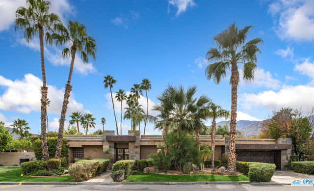 This 1964 mid-century modern home has some of the most coveted views in Palm Springs. Perfectly oriented with a south facing pool for full sun exposure that provides 180 degree mountain views beyond the open fairways. This resort style home has an open floor plan featuring a formal entry, 3 bedrooms, 3 bathrooms with nearly 3,000 feet of interior living space. The living room was designed to entertain and is flanked by a wet bar, fireplace, dining room and 18 feet of sliding glass doors that open to the large back yard, pool and spa. The primary bedroom with en suite bath is nicely separated from the two guest bedrooms for privacy. The kitchen is centrally located, adjacent to a separate den and secondary fireplace, and offers a generously sized eating nook/bar that opens onto the patio - perfect for that Palm Springs indoor/outdoor entertaining. The expansive patio area, with a variety of citrus trees, offers multiple conversation areas that surround the oversized pool and elevated spa. A bridge extends over the pool that leads to the built in BBQ. Two bar stools within the pool are perfectly placed next to an inviting lanai with a covered seating conversation area and wonderful gas fire pit. This home makes the perfect weekend getaway, vacation rental, or forever home. No HOAs and no mandatory golf fees.