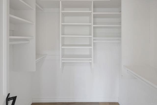 Spacious walk-in closets.  Custom Shelving + Hanging Rods.  Room for ALL your Clothing + Accessories