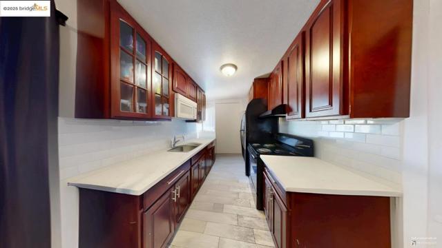 2120 E 22Nd St, Oakland CA: https://media.crmls.org/mediaz/ac18f7bc-1c6b-48c5-b83e-7bd44c6da18d.jpg