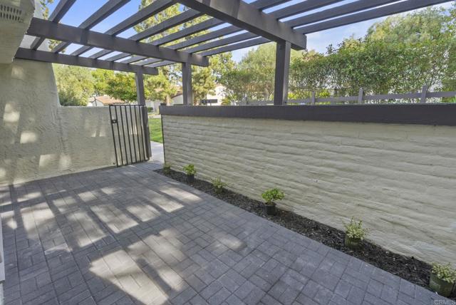 Newly painted front gate leads to inviting space.  Add string lights + a fountain, if you like ;-)