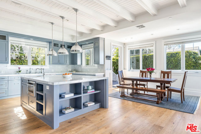 16056 Aiglon Street Pacific Palisades, California Quintessential Cape Cod Farmhouse on the coveted El Medio bluffs. Located on a corner lot with no neighbors on three sides. The main floor provides an open flow kitchen/family room leading to the large outdoor patio and grassy play area complete with retractable awning to provide ample outdoor entertaining space. The whole house has light wide planked hardwood floors, an abundance of natural light and treetop and mountain views. Gourmet chef's kitchen with white Carrera marble counters and custom cabinetry. Large center island with seating, top of the line appliances including a wine fridge and farmhouse sink. Butler's pantry, large walk in pantry plus lower level pantry. Upstairs are four good sized bedrooms. The gorgeous primary suite has a fireplace, large walk-in closet, private deck with views and a spa-like bath complete with soaking tub and rain shower. Four of the five bathrooms have Japanese TOTO toilets. The lower level has a wine cellar room, fantastic work out/music room and direct access to an oversized 2 car garage with cabinets. This special home has a solar panel system and Tesla powerwall. Solar powered Ring system with cameras, Aquasana whole house water filtration system. A truly unique home just blocks from the fabulous Palisades village shops, restaurants, schools and Sunday Farmers Market.