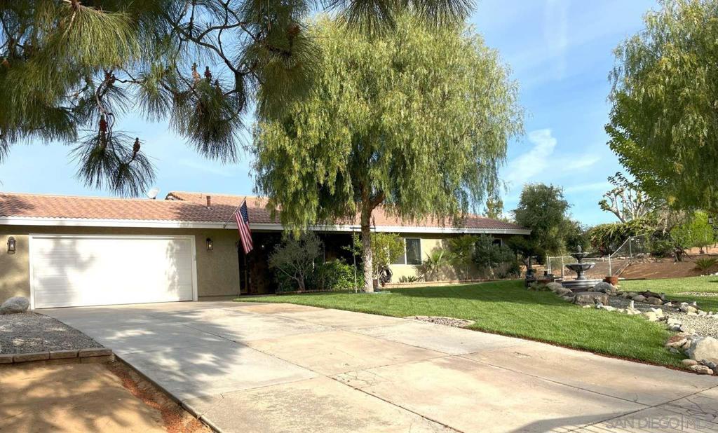 32855 Dorama Ave Acton, California Stunning Acton Ranch Home in one of the most desirable neighborhoods!! Luxury Property on 1.2 Flat Acres! Two front entrance drive-ways with Custom Masonry work, iron fencing, Electric Gates for privacy/security, Manicured lawns & mature trees/irrigated landscaping. Easy freeway access on paved roads with City utilities. The Main Home is just under 2000 sq. ft. with 4 Bedrooms & 2 Full Baths. Entire Home was completely remodeled & updated with Luxury travertine flooring, 4" Baseboards, Crown Molding, Custom Paint, Lighting and Stacked Natural Stone columns. Kitchen has granite counters, custom white cabinetry, stainless appliances, Viking Wall Oven & eat-in bar area which opens to formal dining room with Custom stone fireplace. Both Baths have been highly upgraded with natural stone accents, beautiful fixtures & lighting. Separate 30x40 Workshop behind Main Home with 220 electricity, lighting, heating, A/C, a side entrance and 2 RV Garage Doors, so plenty of room for Covered RV Parking, All the toys, or a separate workspace/studio. Primary Bedroom features remodeled bath with walk-in shower accented with natural stone. 4th Bedroom was converted to a Walk-in Dressing Room with built-in wardrobe organizers & dedicated Vanity area. Back yard has a Patio Cover, ceiling fans, lighting, TV hook-ups, a built-in BBQ area & additional outdoor paved Patio with built-in Firepit & stairs leading to the back property. The Fenced & Covered Horse Corral makes this the Perfect Country Home!