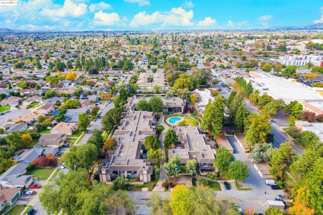 Aerial view of property's location featuring nearby suburban area