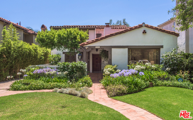 520 17th Street Santa Monica, California This gracious vintage Spanish provides a splendid opportunity to redo, rebuild or restore. The inviting living room with beams and a fireplace is large enough to comfortably hold two grand pianos. A den/office to the left of the entry hall opens through French doors to the enclosed front courtyard patio. A large dining room, kitchen with eating area, downstairs bedroom and bath complete the first floor. Upstairs are four bedrooms, including a primary bedroom with a balcony and original early Santa Monica tile bathroom. Another original tile bath is shared among the other three bedrooms. There are so many charming details, light fixtures and ironwork, as an example. OMG that front door! The driveway starts at the front sidewalk and leads to the two car garage. Plus, it sits on the alley which provides a whole other level of possibility for expansion. It's time for new owners to start their own traditions in this well loved Santa Monica gem.