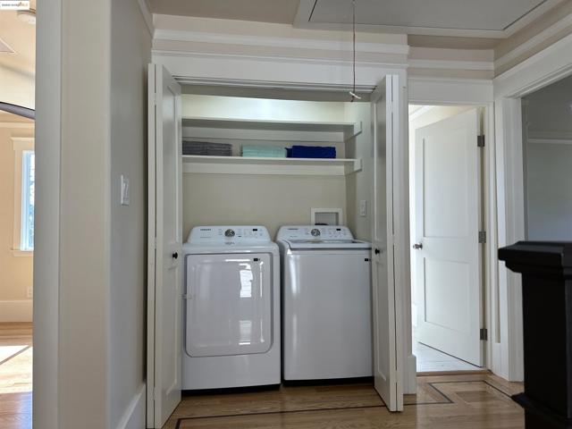 Laundry room featuring separate washer and dryer