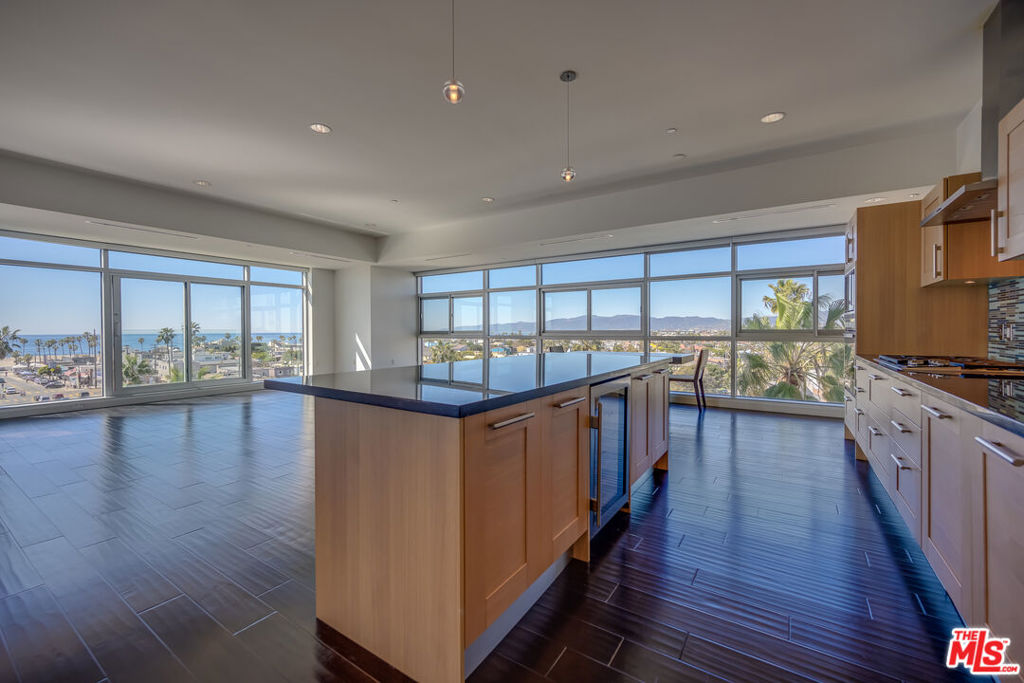 Elevated above the coastline, this home boasts 180-degree panoramic ocean views from Catalina to Malibu! Relax and watch the waves crash into whitewater views while the sailboats pass by. Enjoy the evening sunsets over the ocean as the city lights illuminate from this jaw-dropping, prime northwest corner Sky Tower condo with floor-to-ceiling views from every room! This condo features 3 bedrooms, 3 bathrooms + den and large corner great room all one one level! The 180-degree views are all encompassing; surrounded by the blue ocean and stunning mountains by day and sparkling city lights at night. Designed by award winning - architect KAA Design Group, the property was completed only 12 years ago and includes 10 foot ceilings throughout, along with floor to ceiling and wall-to-wall windows. The grand living room opens to a gourmet kitchen, custom cabinetry, stone counters, designer tile backsplash, and all stainless appliances. The private primary suite has direct ocean views with a luxurious primary bathroom that includes a separate tub, shower, toilet and is accessible to the enormous walk-in closet. The second and third bedrooms are separated from the master and have ocean and mountain views of their own with ample closet space and private bathrooms. The den is a wonderful space for a TV room, library or office. Centrally located to everything the Westside has to offer, this home is walking distance to world class restaurants, shopping, nightlife, and beautiful beaches. The premier Latitude 33 Sky Collection building includes concierge services to receive your packages 24/7, a security staff, state-of-the-art security systems, and a private gym. This turnkey home has it all in an absolutely perfect location! A must see!!!