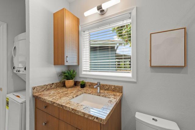 washer dryer stack unit in bathroom