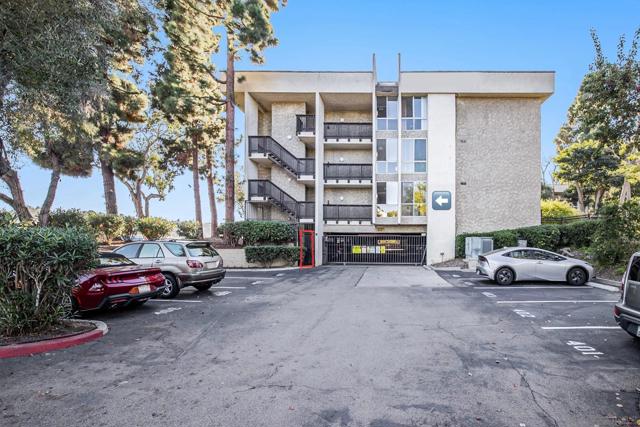 Exterior Assigned Parking Space and Gated Underground Garage. Pedestrian entrance into building adjacent to unit.