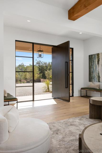 Large, custom pivot door welcomes you into an amazing great room entry.