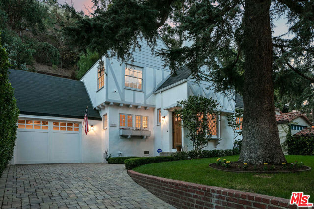 1515 N Beverly Drive Beverly Hills, California Newly remodeled and incredibly charming, this 3 bedroom/3.5 bath Tudor features contemporary interiors and ample backyard entertaining areas in the heart of Beverly Hills. Just down the road from Franklin Canyon and up the street from Rodeo Dr, the home includes a grassy front garden, privately tucked away from the street behind mature hedging. Exuding warmth throughout, the bright, open floor plan leads to a family room, kitchen & dining area that seamlessly flow into the multiple-level outdoor courtyard. The updated kitchen features gas appliances, pantry and breakfast nook. Upstairs, the expansive primary suite beams with natural light through large windows overlooking the courtyard, with a luxuriously appointed bathroom with double rain shower, vanity and soaking tub. Other notable features include two additional ensuite bedrooms, along with a laundry room and storage area. Conveniently located and within the highly rated Warner School district, this is truly a one-of-a-kind gem.