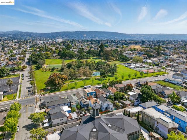 Aerial view of residential area featuring a water and mountain view