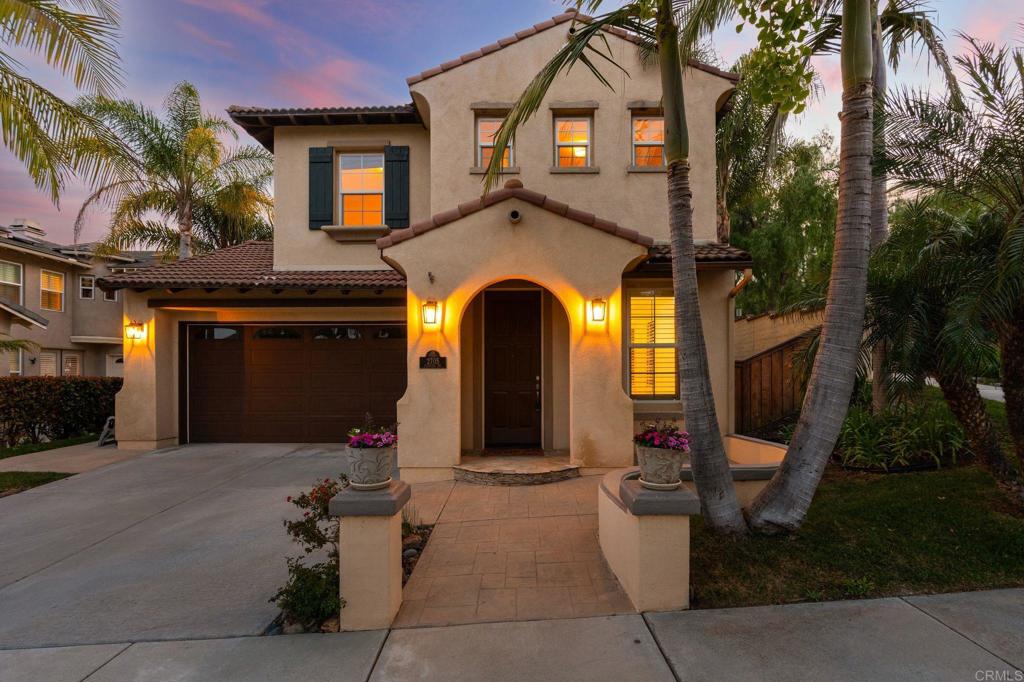 Located in the heart of Bressi Ranch on a private, elevated corner lot, this beautifully maintained 4-bedroom, 3-bath home offers 2,607 sq. ft. of spacious, sunlit living. With no rear neighbors and serene west-facing views of the adjacent greenbelt, you'll enjoy breathtaking sunsets and rare privacy just minutes from everything Carlsbad has to offer. The open floor plan includes a first-floor bedroom and full bath, a versatile upstairs loft, and multiple outdoor living areas, including a peaceful courtyard just off the kitchen—perfect for morning coffee or evening gatherings. The chef’s kitchen features granite slab countertops, stainless steel appliances, a center island with bar seating, pendant lighting, and a cozy breakfast nook that flows seamlessly into the inviting family room. Upgrades throughout the home include crown molding, plantation shutters, tile flooring, brand new carpet, built-in surround sound, and a custom media niche. Large windows frame picturesque backyard views and fill the space with natural light. Enjoy the vibrant Bressi Ranch lifestyle with community amenities including a resort-style pool, spa, parks, and event center. Just a short distance to award-winning Carlsbad schools, Bressi Village shops and dining, and nearby Alga Norte Community Park. This is North County living at its best—stylish, private, and close to it all.