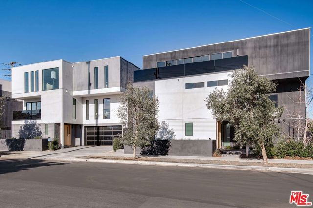 1900 Penmar Avenue Venice, California Be the first to put down roots in this modern coastal retreat fusing bespoke architectural details and high-end finishes with bright, breezy Venice Beach vibes. This new contemporary dwelling dazzles with a sun-filled floor plan designed to optimize calming views and natural light. A stylish oak pivot door leads to an en suite bedroom, with a sliding barn door, which can be used as a home gym or office. The large family room has access to the patio with eco-friendly lawn and lush landscaping. A floating staircase elevates you to the second level where the primary suite invites you to a spacious balcony, walk-in closet, and stunning bathroom with dual Italian vanities and a floating tub housed within a porcelain-clad shower. The level is completed by two additional en suite bedrooms with walk-in closets.The third level has a great room with a fireplace and a designer Italian kitchen featuring Fisher & Paykel appliances, built-in shelving, an island with wraparound breakfast bar and private oversized deck.Additional features include: two-car garage, wide-plank oak floors, smart home automation option, directional adjustable lighting, pneumatic elevator option.