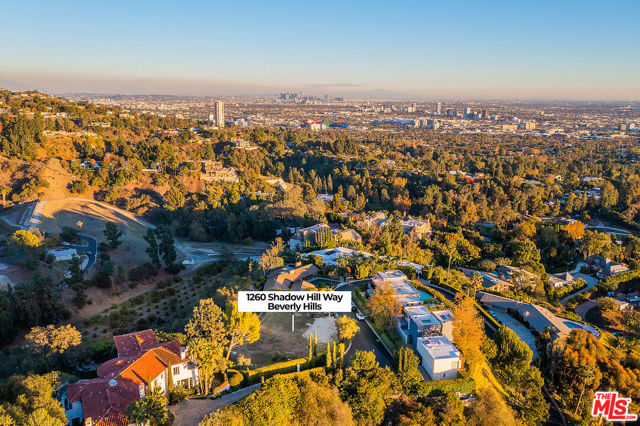 Located on a top-tier lot in the most desired neighborhood of Beverly Hills. The plans & permits have already been issued & approved by the city. It's ready to start construction ASAP.  Situated near the end of a cul-de-sac on an ultra-private & quiet street. Fantastic nature & city views. This homesite comes with plans, designs and entitlements.  Renowned architect, Trevor Abramson, designed and assembled a new 8,491 square foot residence, which epitomizes the contemporary Los Angeles lifestyle of seamless indoor and outdoor living. The proposed subject is a new, custom-built, two-story (three-level), modern style residence; consisting of 12 rooms, 5bedrooms, 6 full, and 2 half (6.2) bathrooms with chefs kitchen. Gated entrance Motor court Fire pit Outdoor kitchen Multiple decks Vanishing edge pool / spa. 3 stop elevator Solar photovoltaic energy system4 Tesla Powerwall battery storage units Multi-Zone HVAC. Wine storage with bar Entertainment room Theater Projector room.