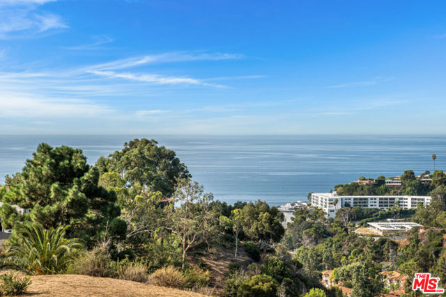 It's time to build your dream home! A rare opportunity to to build a true estate property in the Pacific Palisades on a 2.4 acre lot, with the ability to build up to a 25,000 sf home. This one-of-a-kind location offers breath-taking ocean, mountain and city lights views and is located in a cul-de- sac just .50 miles off Sunset Blvd and 1.5 miles from Palisades Village. A conceptual design for the property has been completed and calls for a 13,000 sf home on 27,000 sf of flat building pads. The luxury design highlights the incredible views from nearly every room and includes massive decking, an in-ground pool, sports court, underground garage and more!  Extensive investigations and reports have already been completed at great expense to the owner. Completed already are: (1) Civil plans for grading with a balanced cut/fill approach (2) Geotechnical report (3) Geology report (4) Structural stability report inclusive of a detailed pile system (5) Conceptual site/home plan and (6) Detailed Property Analysis Memorandum. The heavy lifting has already been done for you!!