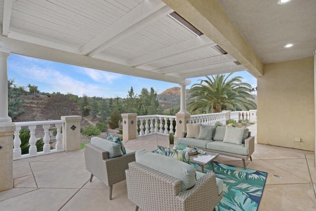 Patio off the formal living area with a Pergola cover, overlooking your yard and citrus garden.