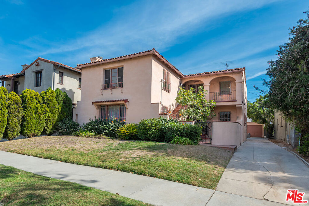 Welcome to 1112/1114 So Point View St, a classic 1929 Spanish duplex nestled in the heart of Los Angeles in historic Carthay Square. Ideal for investors or homeowners interested in rental income, each spacious upper and lower unit features 3 bedrooms and 2 bathrooms, a large open living room with refinished hardwood floors, decorative fireplace, and charming architectural details such as coved ceilings, arched doorways and cozy built-ins.  The freshly painted interiors are bathed in natural light, with large eat-in kitchens and separate dining rooms that feel like a home and capture the charm and allure of the 1920s Spanish design.  Situated in a vibrant neighborhood near Miracle Mile, this property offers ample parking and easy access to a variety of local amenities and major transportation routes, making commuting a breeze.  Whether you are looking to expand your real estate portfolio or seeking a home with additional rental potential, 1112/1114 So. Point View St presents a unique opportunity in an Historic Preservation Overlay Zone (HPOZ) which ensures the neighborhood's architectural heritage is preserved.  Don't miss this exciting find!