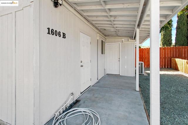 View of exterior entry featuring a patio area