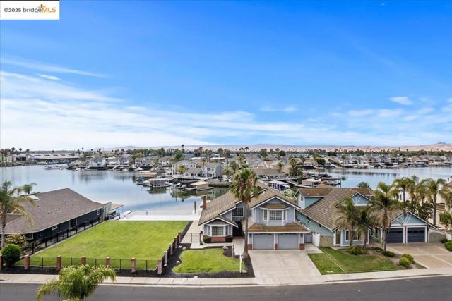 Aerial perspective of suburban area with a large body of water