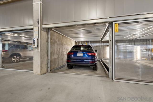 Secured garage features an elevated WOHR parking system that includes two assigned spots in the east and west matrix. Access is provided with a fob or WOHR App on your smart phone.