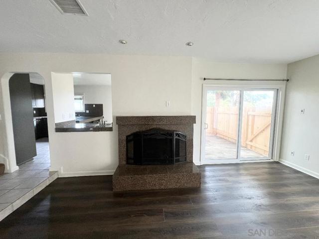 Living room showing fireplace and wet bar