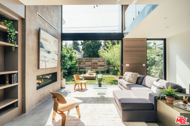 213 Horizon Avenue Venice, California Your ultimate coastal sanctuary awaits at this newly constructed modern paradise, just two blocks in from the sand. The Lion Company presents a captivating contemporary in Venice's beloved Windward Circle. Resting on a street to street lot with parking for 4, this 4 bed 5 bath retreat perfectly combines rich materials with natural tones, creating an inviting and warm palette throughout. Soaring ceilings and double height windows capture an abundance of natural light, bringing the sunny beach vibes within. One of the most substantial master suites in all of Venice, a zen oasis spans across its own entire floor with a gorgeous marble lined spa bath, dual closets, outdoor hot tub and two patio decks. An elevator provides quick access to an oversized rooftop, ideal for entertaining, al-fresco dining, and basking under the sun while enjoying breathtaking views from the coast to the Hollywood Hills. Striking style, the Venice Beach way. Home, is here.