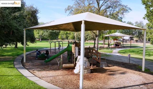 Community playground featuring a yard and a gazebo