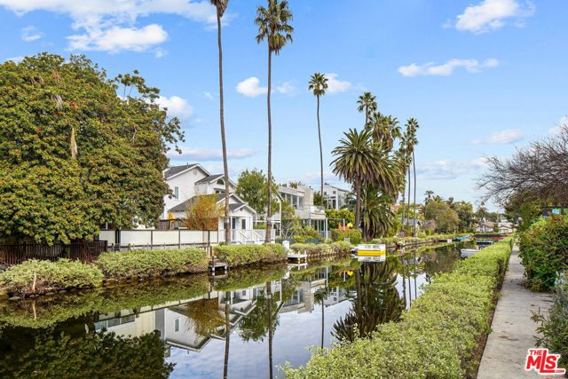 411 LINNIE CANAL Venice, California Live exceptionally on the historic Venice Canals of America. Linnie Canal is one of the most desirable island canals, and this property faces South, which means peaceful sun filled mornings sitting on the porch of this lovely home. A two-story traditional home with 2-bedrooms and 2 full baths. Every room throughout this home has French doors leading to decks and balconies, which are wonderful scenic sanctuaries. The Studio space above the garage, was added in 1986, and has two rooms and a bath. This property has CA Coastal Commission approval to rebuild and expand to a 3000 plus square foot home. Architectural plans available to view. Offers due by Wednesday January 12th at 12pm. Property Sold As-IS