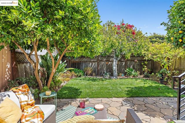 Fenced backyard featuring a patio