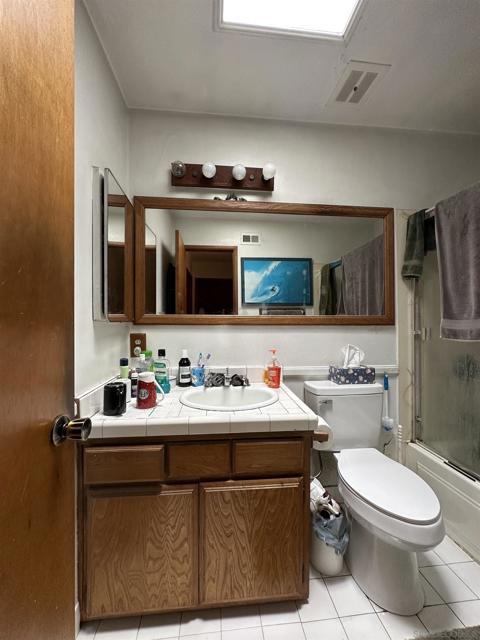 Hall bathroom features a tub/shower combination.