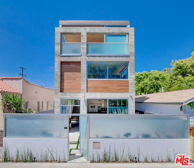 Stunning ( Robert Thibodeau designed ) architectural home, steps away from Abbot kinney Blvd, located on one of the most sought after streets in Venice. This 3 story 3 BR /3.5 BA 3411 sqft spectacular residence, has some of the best design, contemporary finishes and features anyone could wish for. Including polished concrete and hardwood flooring, custom cabinetry, Meile appliances in the bespoke Italian kitchen, Redwood ceilings in the master and living areas, spectacular bespoke bathrooms, including a master bathroom with steam shower and stunning Calcutta marble throughout. Additional features include a bonus living area, fabulous roof deck, balcony and yard areas, walk in closet, two car garage and a "smart home" entertainment / management system. Generous custom windows amplify the bright, airy, and modern atmosphere, giving the home a truly uplifting and spacious feel. A truly one of kind Venice home in both design and location, the best Venice Beach has too offer.