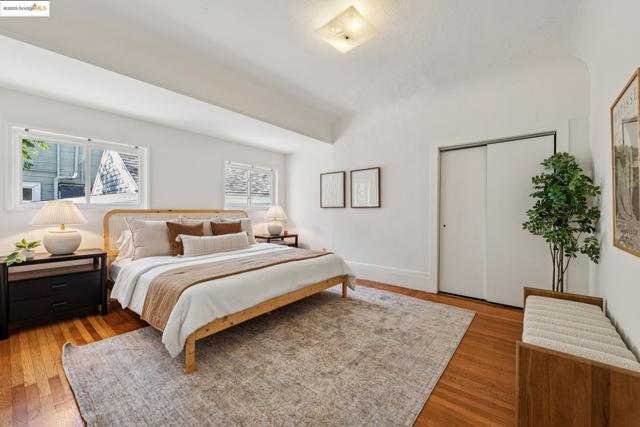 Bedroom with a closet and wood-type flooring
