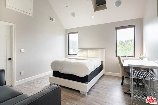 Bedroom #3 is furnished with a full sized bed and night stand.