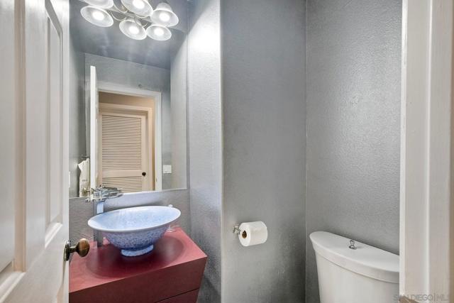 Downstairs Powder Room was updated with a stunning vessel sink and beautiful fixtures.