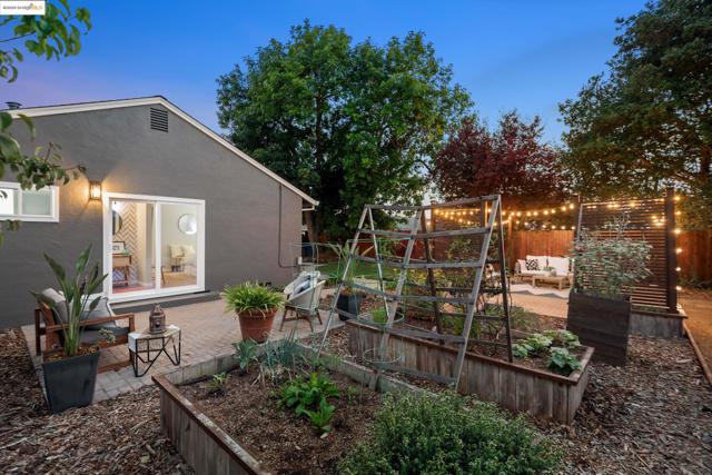 View of yard featuring a patio area and a garden