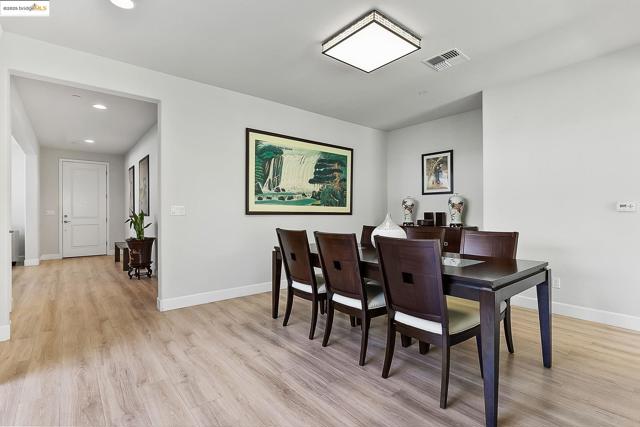 Dining area featuring light wood finished floors and recessed lighting