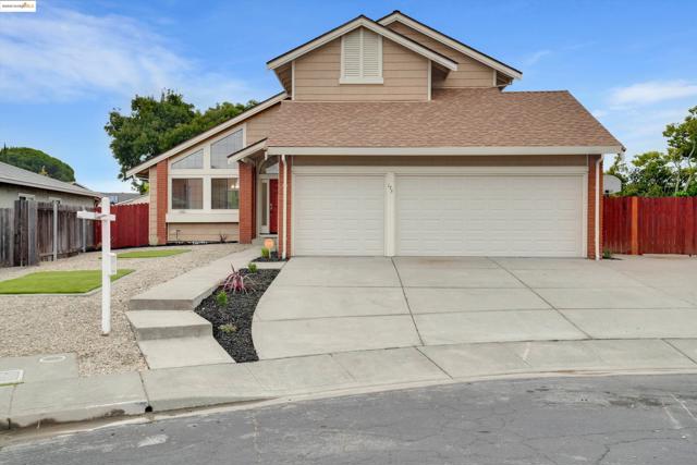 View of front of property with brick siding, concrete driveway, roof with shingles, and an attached garage