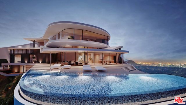 9442 Sierra Mar Place Los Angeles, California Incredibly rare opportunity to build a 15,152 sq. ft. world-class estate situated on a large 30,679 sq. ft. promontory with wraparound views from Downtown to the ocean and Santa Monica Mountains. Included in the purchase are RTI plans by Vantage Design Group that would no longer be approved under current building codes. The plans feature 8 beds, 13 baths, a motor court, a large 1,500 sq. ft. primary suite with terracing, a full-level spa, and over 6,000 sq. ft. of beautifully landscaped outdoor entertainment space.